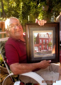 Raymond with framed portrait001