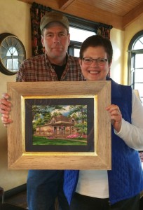 Jennifer and husband with portrait