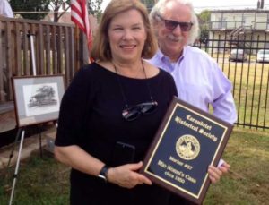 Marcia Dorsey holding plaque