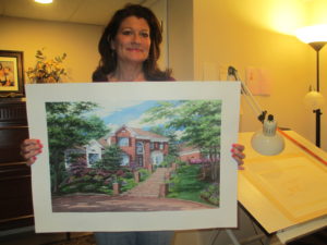 Richelle holding watercolor portrait