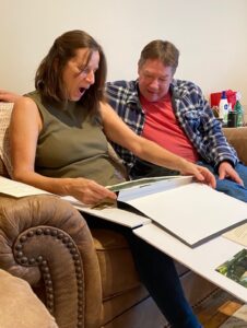 Recipients unwrap their house portrait gift