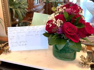 Red roses and thank you card from client