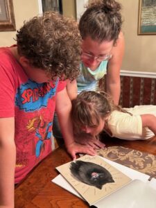 family looking at portrait of beloved dog
